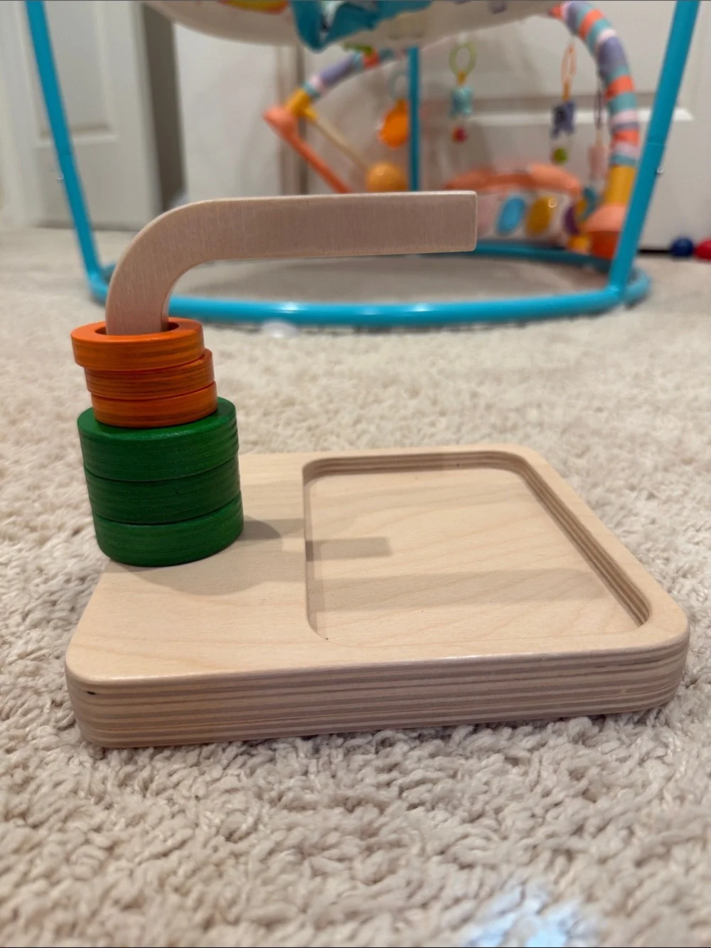 Wooden Stacking Toy with Green and Orange Discs